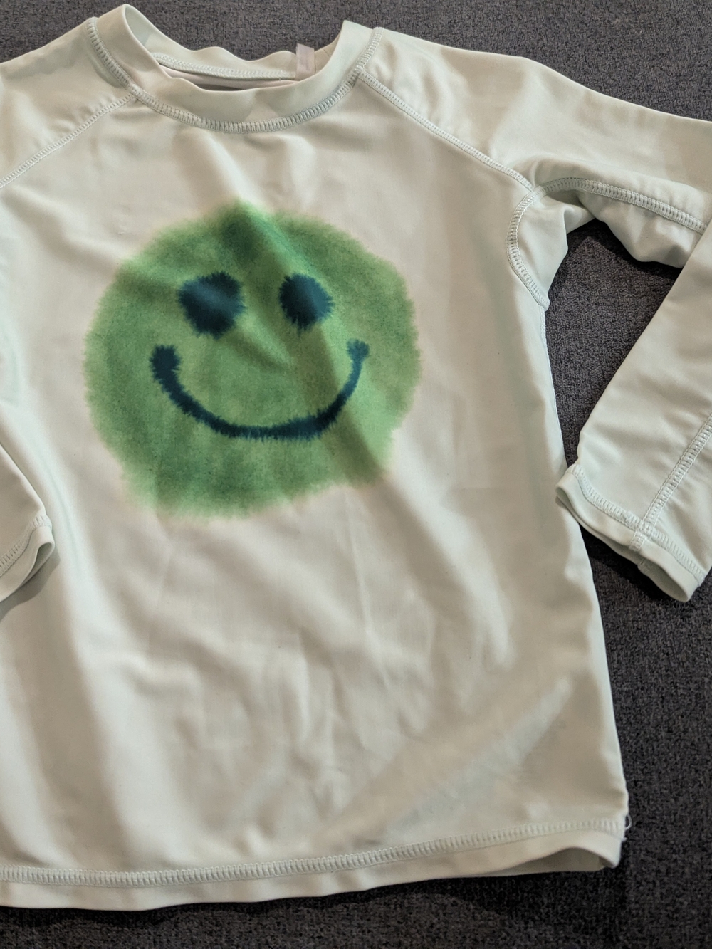 Molo Rashguard with Green Smiley Graphic